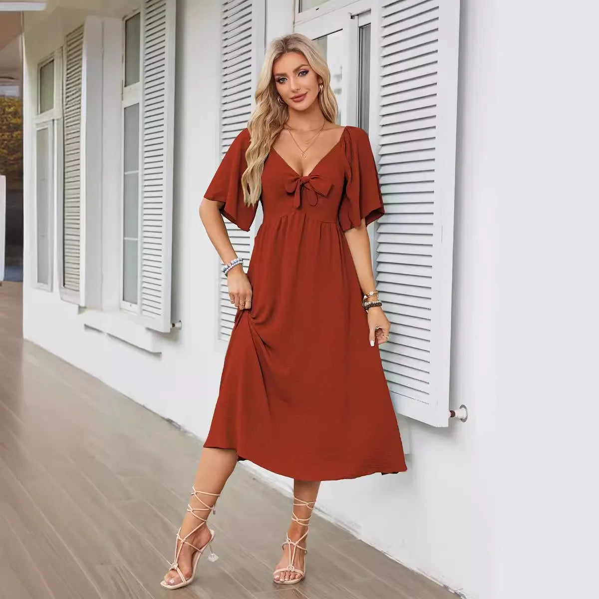 2025 Spring/Summer Women's Dress Fashion New V-neck Bow Fold Medium Length Short Sleeved Dress Printed Holiday Beach Long Dress