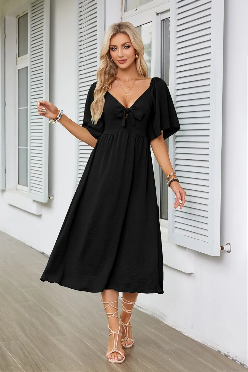2025 Spring/Summer Women's Dress Fashion New V-neck Bow Fold Medium Length Short Sleeved Dress Printed Holiday Beach Long Dress