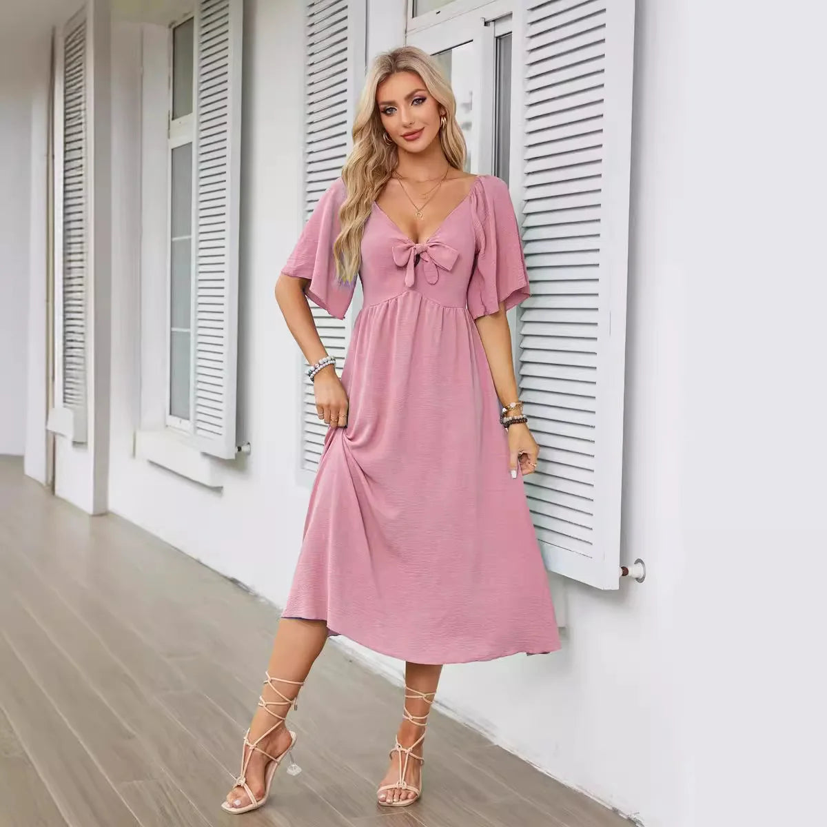 2025 Spring/Summer Women's Dress Fashion New V-neck Bow Fold Medium Length Short Sleeved Dress Printed Holiday Beach Long Dress