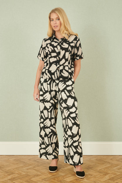 Yumi Black Cotton Splash Print Relaxed Fit Trousers