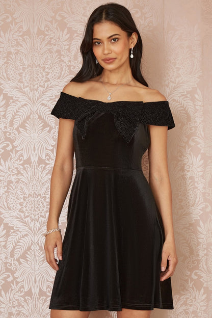 Mela Black Velvet Skater Dress With Sparkle Bow Neckline